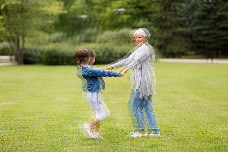 Double Vision of an Elderly Woman Playing With a Child